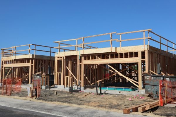 New residential construction with wooden framing in Elk Grove, California.